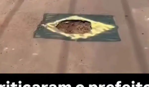 Em clima de Copa do Mundo, moradores pintam buracos nas ruas com cores do Brasil; vídeo