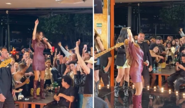 Maiara sobe em mesa, vira taça de vinho e agita gravação em Goiânia
