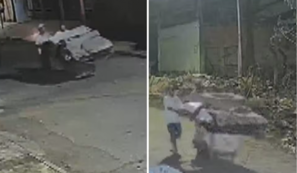 Homens são filmados levando corpo em carrinho até mata em Aparecida